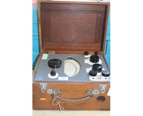 A vintage boxed Cambridge AC test set 