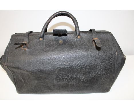 A vintage leather Gladstone style bag. 