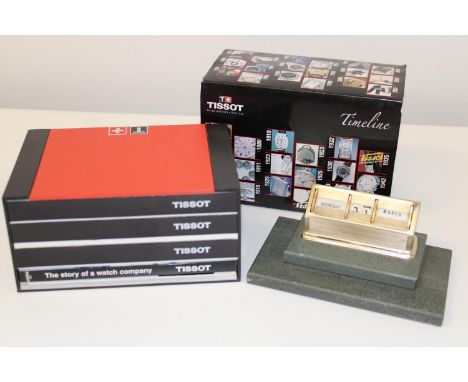 A Tissot watch box &amp; collectors books &amp; a vintage perpetual calendar 