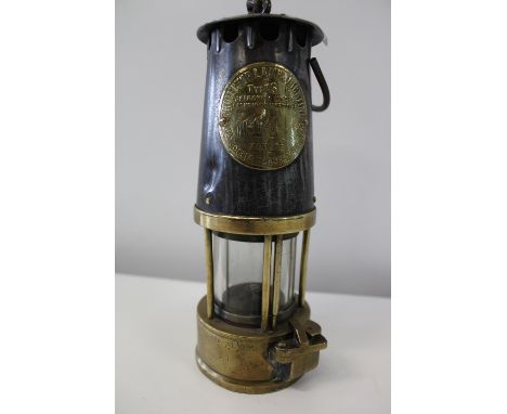 A vintage brass miners lamp 