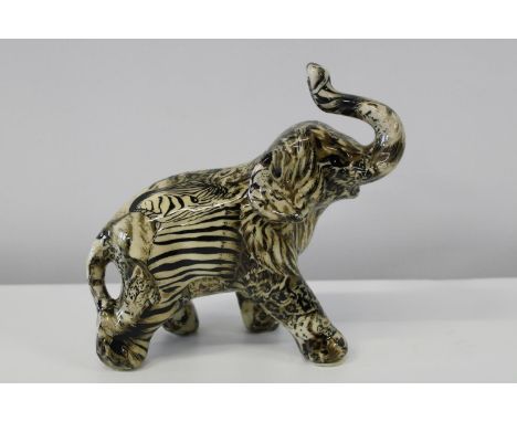 A Collage safari ceramic elephant figurine 