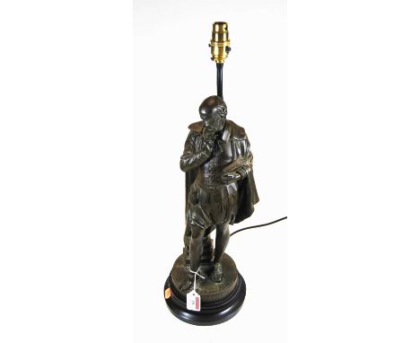 A 20th century cast metal table lamp in the form of Shakespeare in standing pose, on circular plinth inscribed 'Shakespeare',