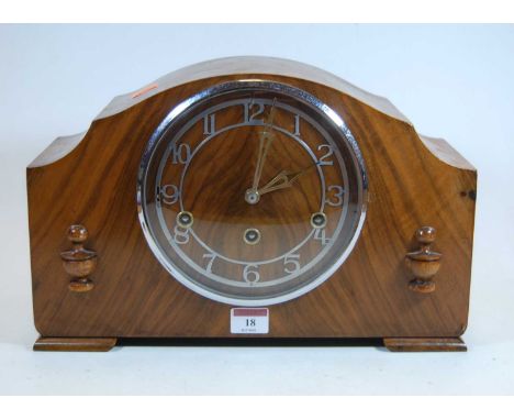 A 1930s walnut cased mantel clock, the chapter ring showing Arabic numerals, eight day movement with Westminster chimes, heig