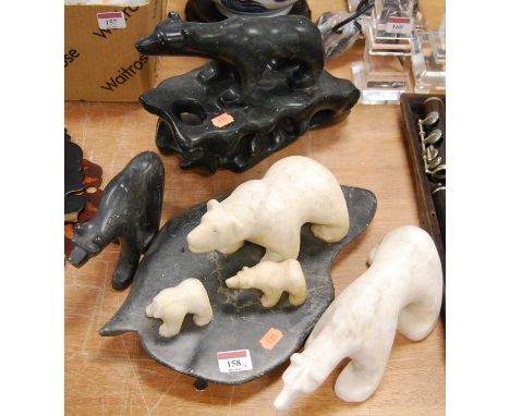 A polished serpentine marble model of a polar bear, together with three other similar models of polar bear, largest 21cm high