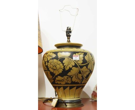 A 20th century pottery table lamp of squat baluster form, decorated with foliage, height 55cm including fittings