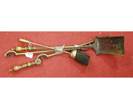 A set of brass fire tools 