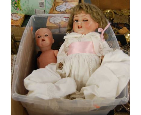 An Armand Marseille bisque head doll, having rolling blue eyes, open mouth with two top teeth showing, and bent limbed compos