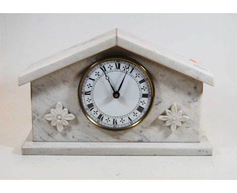 A 20th century marble cased mantel clock, the dial showing Roman numerals, the case of architectural form with applied rosett