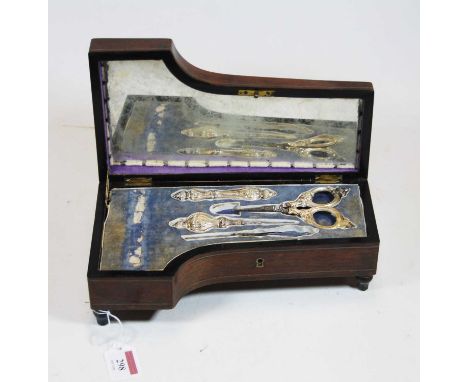 A Victorian lady's rosewood and pewter inlaid needlework box, in the form of a grand piano, the hinged lid with inset pin cus
