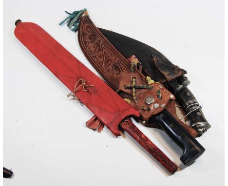 A Nepalese tourist kukri knife with leather scabbard, and two others (3)