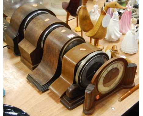An early 20th century oak cased mantel clock, and five others similar, largest height 23cm