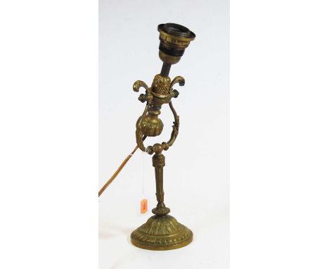 An early 20th century brass adjustable table lamp, the domed circular foot with acanthus and dentil decoration, height 35cm
