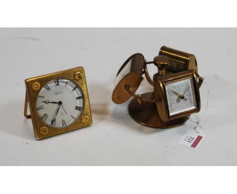 A mid 20th century German brass revolving desk stand having three revolving apertures to include clock, barometer and perpetu