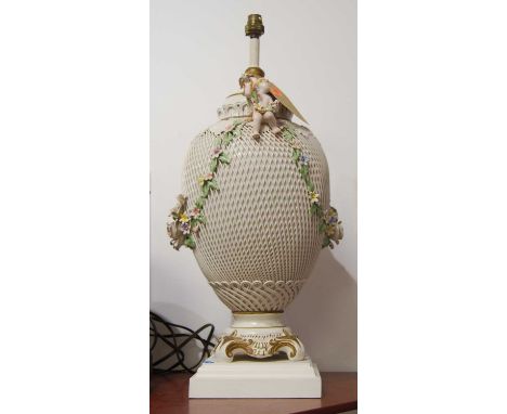 A 20th century continental lattice work porcelain table lamp with floral encrusted decoration, height 61cm including fittings