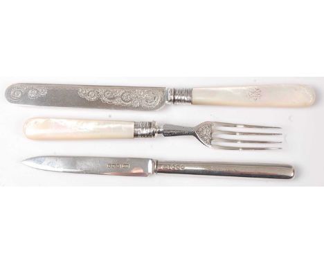 A Victorian silver bladed and mother of pearl handled dessert knife and fork; together with a silver butter knife (3)