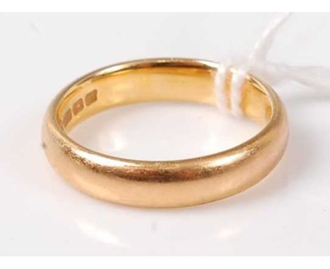 A 22ct gold wedding band, 5.4g, size K/L