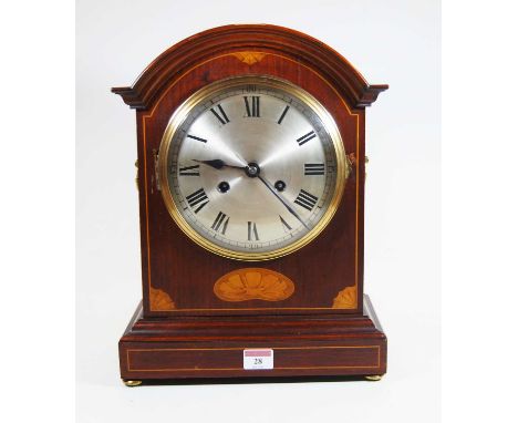 An early 20th century mahogany and box wood strung bracket clock, the silvered dial showing Roman numerals, 8-day movement, t