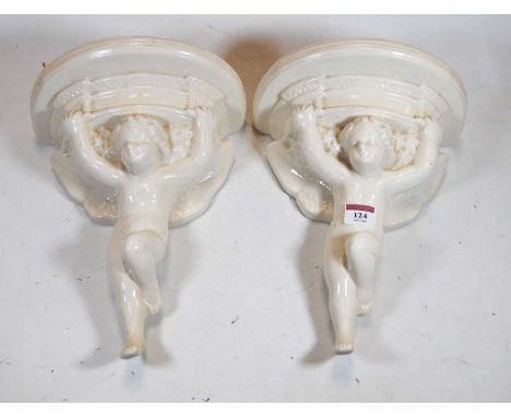 A pair of 20th century Poole Pottery style wall brackets in the form of putto, incised verso, height 28cm eachCondition repor