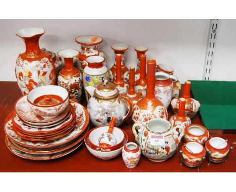 A large collection of Japanese Kutani and other similar ceramics, to include bottle vases, teapot, plates, and salts 