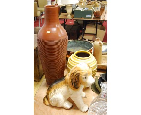 A 20th century ceramic model of a dog, height 36cm, together with two 20th century pottery vases