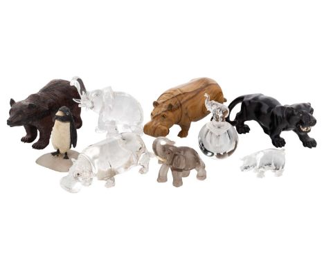 A GROUP OF NINE RUSSIAN HARDSTONE ANIMAL FIGURINES AND PERFUME FLASK comprising:a) a realistically modelled rock crystal elep