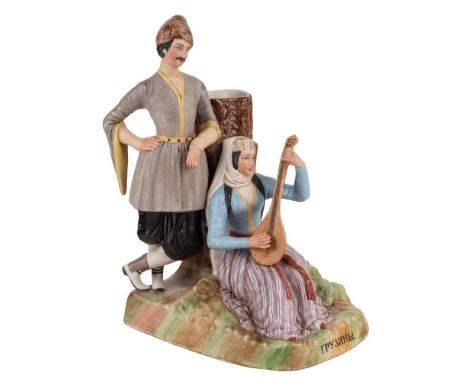 A RUSSIAN PORCELAIN SPILL VASE WITH A GEORGIAN MAN AND WOMAN, FROM THE "PEOPLE OF RUSSIA" SERIES, GARDNER PORCELAIN FACTORY, 