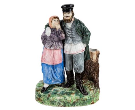 A RUSSIAN PORCELAIN FIGURAL GROUP OF A PEASANT COUPLE, KUZNETSOV PORCELAIN FACTORY, TVER, 1889-1917 realistically modelled co