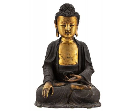 A GILT BRONZE FIGURE OF BUDDHA SHAKYAMUNI, MING DYNASTY, 16TH-17TH CENTURY bronze with dark brown patina, the face, torso, ar