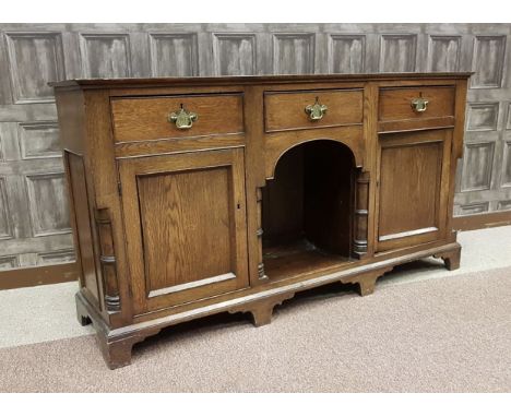 GEORGE III OAK BACKLESS DRESSER, the top with moulded edge, three short frieze drawers, with central open recess flanked by t