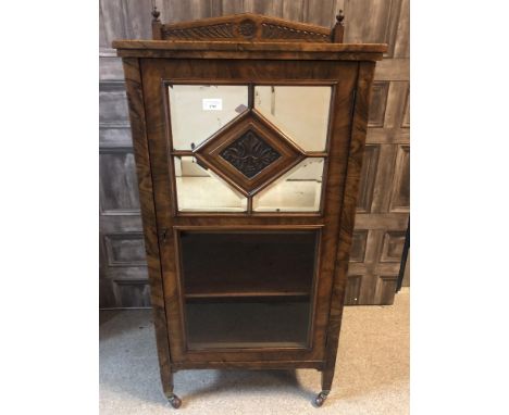 VICTORIAN WALNUT MUSIC CABINET, the quarter veneered top with rosette carved arched back, shelving below enclosed by a mirror