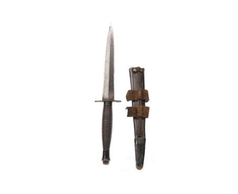 WORLD WAR II COMMANDO DAGGER BY FAIRBAIRN SYKES, with ring grip and double edged blade, with leather scabbard, approximately 