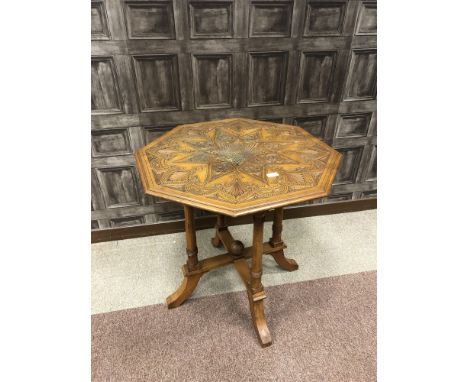 LATE VICTORIAN WALNUT OCTAGONAL CENTRE TABLE, the top intricately and attractively carved with geometric and floral motifs, o