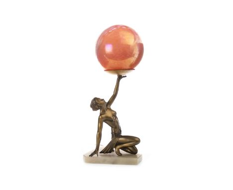 ART DECO GILDED SPELTER LAMP, in the form of a partially clad female, her left arm held aloft to support the pink/red mottled