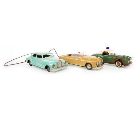 ARNOLD TIN PLATE MODEL CAR, with winding mechanism; along with a Schuco Elektro Razzia Car 5509, in green, and another model 