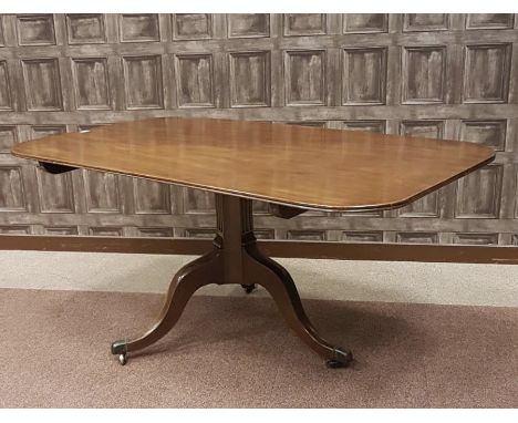 REGENCY MAHOGANY OBLONG BREAKFAST TABLE, the top with rounded corners and moulded edge, on a concave and fluted pillar, on tr