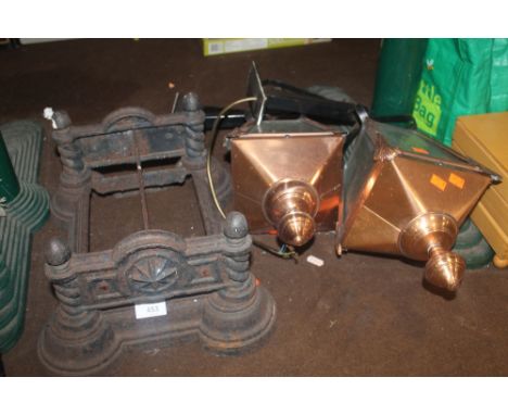 TWO COPPER EFFECT LAMPS, AND A CAST GRATE