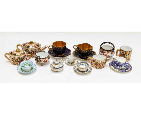 A Davenport Imari miniature dolls teaset, together with a Crown Staffordshire example on cabaret tray, a Paragon miniature te