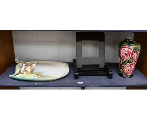 A Wemyss lamp base, painted with pink cabbage roses on a black ground, painted WEMYSS mark, 30cm high; and a Franz limited ed