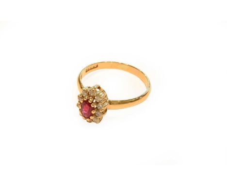 A 22 carat gold synthetic ruby and diamond cluster ring, finger size J1/2Gross weight 2.3 grams.