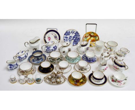 A quantity of miniature porcelain tea and coffee wares, including Spode, Coalport, Royal Crown Derby, Caverswall (quantity)