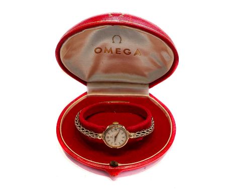 A ladies 9 carat gold wristwatch, signed Omega, (calibre 244) manual wound lever movement signed and numbered 16730715, silve