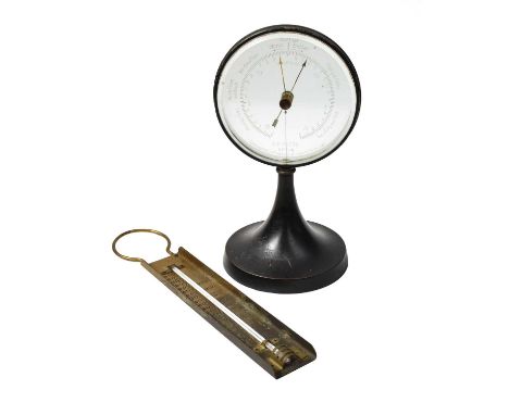 A Goerz centre pedestal desk barometer with mystery dial, together with a brass thermometer (2)