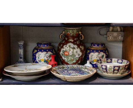 A pair of decorative Chinese porcerlain jars and covers, a similar twin handled vase, a delft candlestick and Iznik type piec