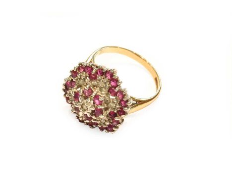 A 9 carat gold ruby and diamond cluster ring, finger size L1/2Gross weight 5.0 grams.