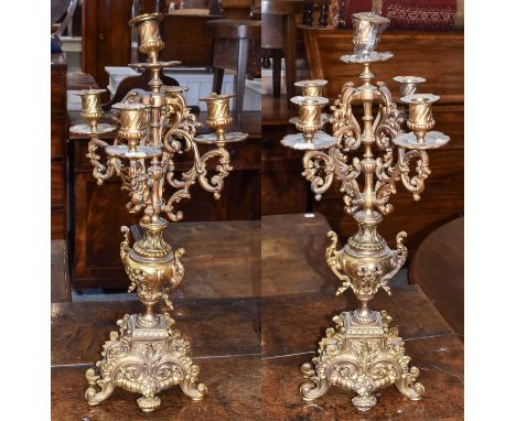 A pair of late 19th Century gilt brass five light candelabra 