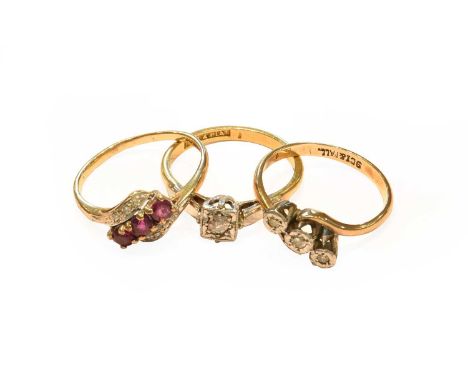 A diamond solitaire ring, stamped '18CT&amp;PLAT', finger size K1/2; a 9 carat gold ruby and diamond ring, finger size K; and