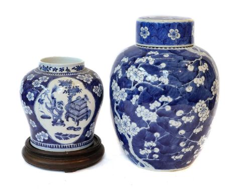 A 19th Century Chinese Kangxi style prunus blossom jar and cover, another blue and white ginger jar, Chinese export porcelain