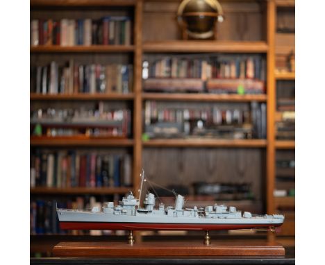 This is a meticulously crafted scale model of a U.S. Navy destroyer, mounted on a polished wooden base with brass supports. D