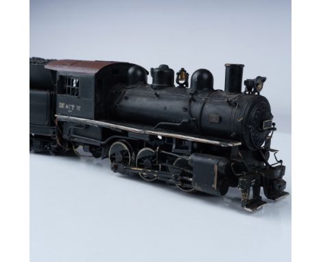 A vintage metal model of the LE &amp; FT W B-7 steam locomotive and coal tender. This collectible features intricate craftsma
