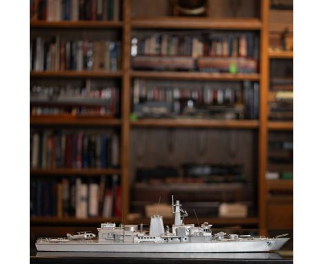 This is a finely crafted scale model of a naval destroyer, showcasing exceptional attention to detail and craftsmanship. Made